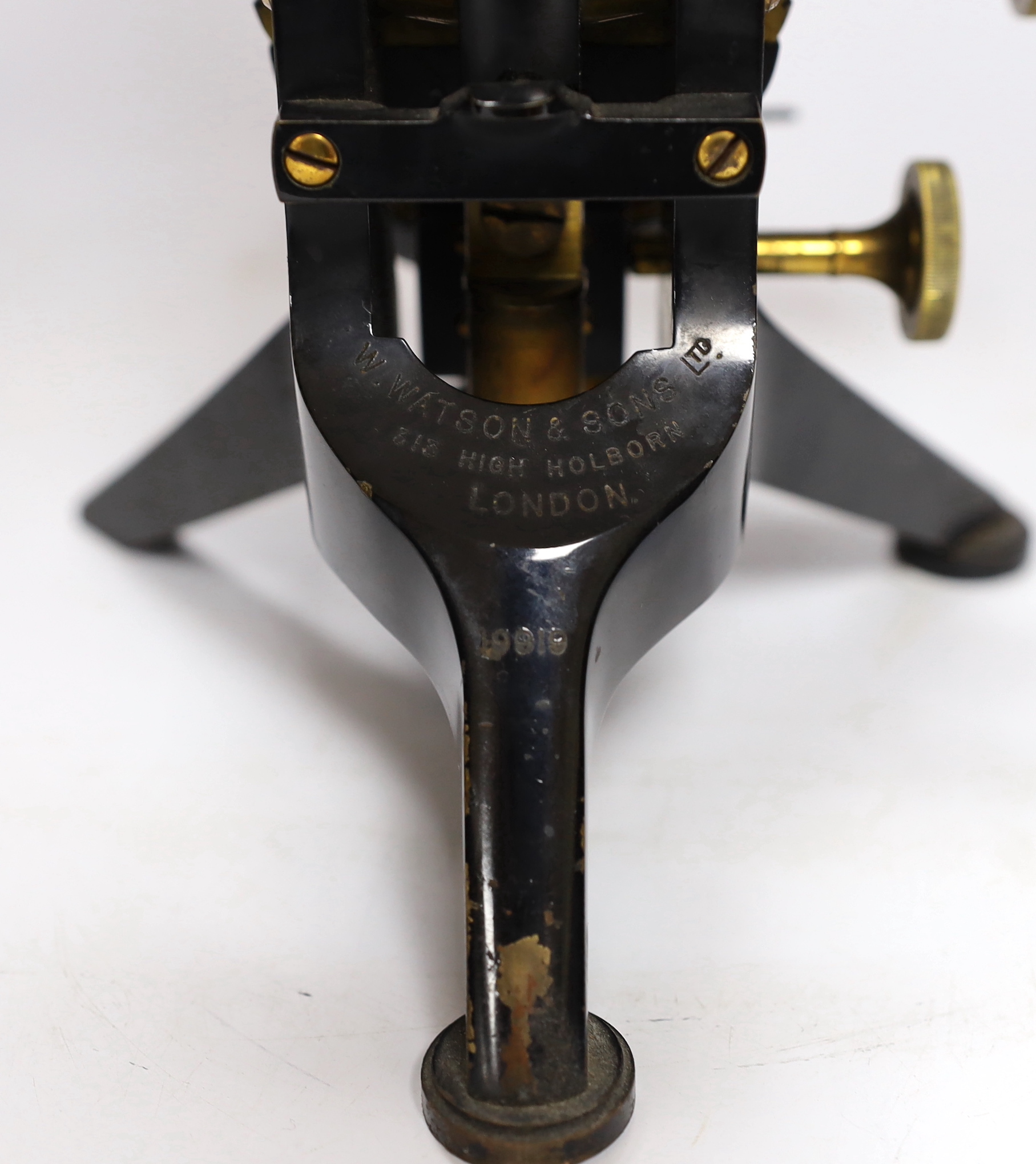 A Victorian monocular brass and black enamel microscope by W. Watson & Sons, High Holborn, in a mahogany carrying case, Serial no.19919, with a number of alternative lens of different magnification, case 34.5cm high
